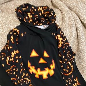 A well loved lulaRoe large jack-o’-lantern hoodie with front pocket.